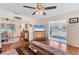 Open living space with hardwood floors, adjacent dining area, and a view to a sunroom at 401 N Jefferson Ave, Sarasota, FL 34237
