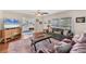 Comfortable living room with hardwood floors, large windows, and seamless flow to other rooms at 401 N Jefferson Ave, Sarasota, FL 34237