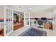 Bright home office featuring white french doors, a ceiling fan, and an adjacent seating area at 401 N Jefferson Ave, Sarasota, FL 34237