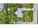 Aerial view shows the home's landscaping, roof, and proximity to nearby street at 408 67Th W Ave, Bradenton, FL 34207