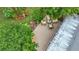 Aerial view of backyard patio featuring outdoor seating and meticulous landscaping at 408 67Th W Ave, Bradenton, FL 34207