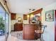 Home bar with wood counters and cabinets, plus stylish light fixtures at 408 67Th W Ave, Bradenton, FL 34207