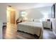 Cozy bedroom featuring light gray walls and wood floors at 408 67Th W Ave, Bradenton, FL 34207