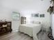 Cozy bedroom with a comfortable bed, ample natural light, and a quaint bookshelf at 408 67Th W Ave, Bradenton, FL 34207