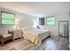 Bright bedroom with natural light, wood floors, and neutral decor at 408 67Th W Ave, Bradenton, FL 34207
