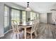 Well-lit dining room with a bay window and wood flooring, perfect for Gathering meals and entertaining guests at 408 67Th W Ave, Bradenton, FL 34207