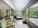 Bright Florida room with tile flooring and multiple sliding glass doors for enjoying the outdoors at 408 67Th W Ave, Bradenton, FL 34207