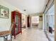 Hallway with tiled floors and views of the living room and bedroom at 408 67Th W Ave, Bradenton, FL 34207