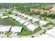 A serene aerial view of the community, highlighting the pond and lush green landscape at 4107 Brittany Ln # 18, Sarasota, FL 34233