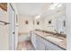 Spacious bathroom with double sink vanity featuring granite countertop at 4107 Brittany Ln # 18, Sarasota, FL 34233