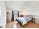 Bedroom with parquet floors, ceiling fan, and a window covered by dark curtains at 4107 Brittany Ln # 18, Sarasota, FL 34233