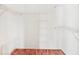 Walk-in closet with wood floors and metal shelving at 4107 Brittany Ln # 18, Sarasota, FL 34233