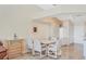 Bright dining room with tile floors, white walls, wine rack, and dining table at 4107 Brittany Ln # 18, Sarasota, FL 34233
