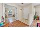 Inviting entryway with tile flooring, coat hooks, and views into the living areas at 4107 Brittany Ln # 18, Sarasota, FL 34233