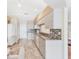 Bright kitchen with white appliances, cabinets, tile backsplash and marble countertops at 4107 Brittany Ln # 18, Sarasota, FL 34233