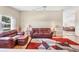 Spacious living room with a plush leather sofa set, stylish rug and ample natural light at 4107 Brittany Ln # 18, Sarasota, FL 34233