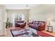Bright living room with high ceilings, comfortable seating, and a large window overlooking the outdoors at 4107 Brittany Ln # 18, Sarasota, FL 34233
