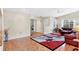 Open-concept living area with parquet floors, neutral walls, and view of an adjoining room at 4107 Brittany Ln # 18, Sarasota, FL 34233