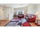 Inviting living room featuring vaulted ceilings, wood floors, and natural light from a large window at 4107 Brittany Ln # 18, Sarasota, FL 34233