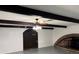 Unique basement space with exposed beams, brick fireplace, and neutral colored walls at 4158 Prudence Dr, Sarasota, FL 34235