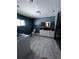 Modern bathroom with wood plank tile flooring, double sink vanity at 4158 Prudence Dr, Sarasota, FL 34235