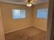 Bright bedroom with carpet, neutral walls and two windows at 4158 Prudence Dr, Sarasota, FL 34235