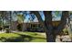 Lovely single-story home with a brick accent, mature landscaping, and a well-manicured lawn at 4158 Prudence Dr, Sarasota, FL 34235