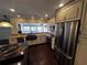 Modern kitchen featuring stainless steel appliances, granite countertops, and ample cabinet space at 4158 Prudence Dr, Sarasota, FL 34235