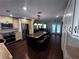 Spacious kitchen with a granite island, stainless steel appliances, and hardwood floors at 4158 Prudence Dr, Sarasota, FL 34235