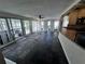 Bright living room with large windows and beautiful slate floors at 4158 Prudence Dr, Sarasota, FL 34235