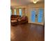 Comfortable living room with hardwood floors, a leather sofa set, and natural light at 4158 Prudence Dr, Sarasota, FL 34235