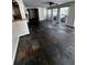 Bright living room featuring slate tile flooring, large windows, and plenty of natural light at 4158 Prudence Dr, Sarasota, FL 34235