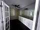 Home office or den featuring french doors and mirrors at 4158 Prudence Dr, Sarasota, FL 34235