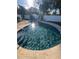 Inviting in-ground pool with sunlit water and surrounding deck at 4158 Prudence Dr, Sarasota, FL 34235