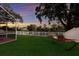 Lush backyard featuring a relaxing hammock and screened-in porch, perfect for outdoor enjoyment at 4410 67Th Avenue E Cir, Sarasota, FL 34243