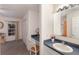 Bright bathroom with a desk/vanity area with seating and a window at 4410 67Th Avenue E Cir, Sarasota, FL 34243