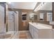 Modern bathroom with glass shower enclosure and ample counter space at 4410 67Th Avenue E Cir, Sarasota, FL 34243