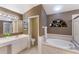 Spa-like bathroom with soaking tub, separate shower, and elegant fixtures perfect for relaxation at 4410 67Th Avenue E Cir, Sarasota, FL 34243