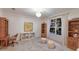 Bright bedroom with large window, chandelier, and neutral decor offering a calming atmosphere at 4410 67Th Avenue E Cir, Sarasota, FL 34243