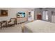 Bright bedroom with neutral paint, and natural light showcasing a relaxing retreat at 4410 67Th Avenue E Cir, Sarasota, FL 34243