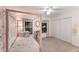 Charming bedroom with a four-poster bed, floral wallpaper, and natural light, perfect for a  at 4410 67Th Avenue E Cir, Sarasota, FL 34243