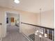 Upstairs hallway with a view into a bedroom through an open door at 4410 67Th Avenue E Cir, Sarasota, FL 34243