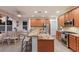 Spacious kitchen island with seating, granite counters, and stainless appliances in a well-lit area at 4410 67Th Avenue E Cir, Sarasota, FL 34243