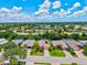 Desirable neighborhood with mature landscaping, serene ponds, and well-maintained homes under sunny skies at 5004 Creekside Trl, Sarasota, FL 34243
