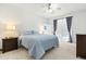 This well lit room is complete with a large window and calming blue comforter at 5004 Creekside Trl, Sarasota, FL 34243
