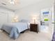 Bright bedroom with hardwood floors and open view to the adjacent living area at 5004 Creekside Trl, Sarasota, FL 34243