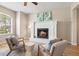 Warm, inviting living room featuring a fireplace, comfortable seating, and a relaxing atmosphere at 5004 Creekside Trl, Sarasota, FL 34243