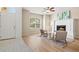 Bright living room featuring wood floors, a cozy fireplace, and stylish decor with an inviting atmosphere at 5004 Creekside Trl, Sarasota, FL 34243