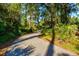 Lush walking path meandering through a verdant landscape, offering a serene and picturesque outdoor experience at 5004 Creekside Trl, Sarasota, FL 34243