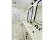 Bathroom featuring double sinks, modern fixtures, and elegant marble flooring at 5009 Jody Ave, North Port, FL 34288